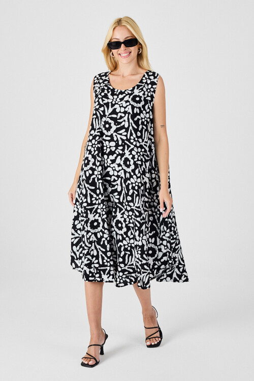 Siyah-Beyaz U Yaka Kolsuz Eteği Asimetrik Kesim Desenli Midi Boy Elbise